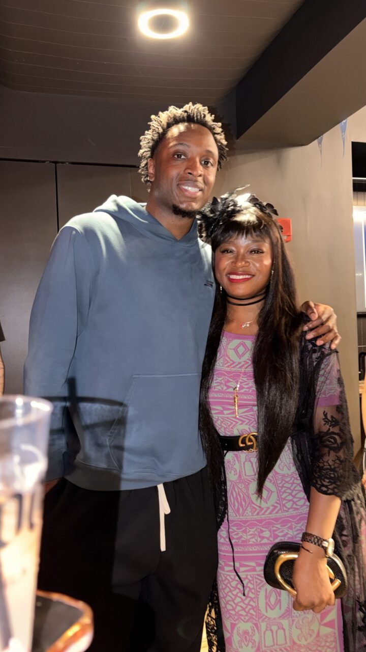 Francine Mbvoumbo with a guest at a sport and culture event